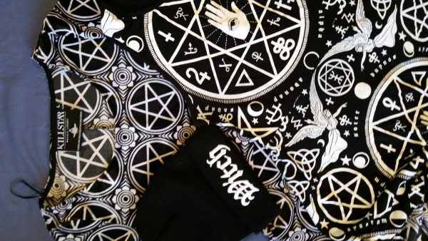 Clothing from the Gothic brand Killstar. The clothing features Pagan, Occult, Satanic and Celtic imagery, blending multiple images to create one overall style.